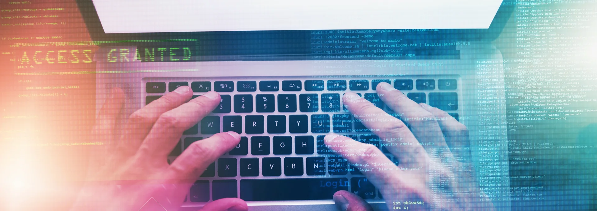 Auf dem Fotos ist ein Laptop mit zwei Händen beim Schreiben auf der Tastatur zu sehen